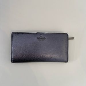 Kate spade slim by fold wallet. Very clean. Used for one day.